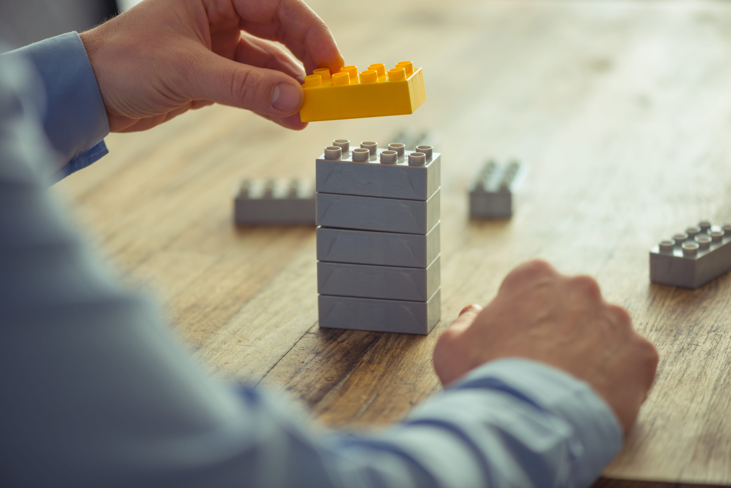 Businessman using lego blocks